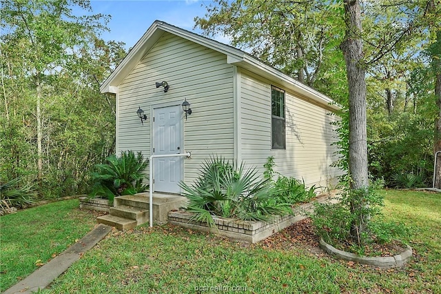 view of outdoor structure with a lawn