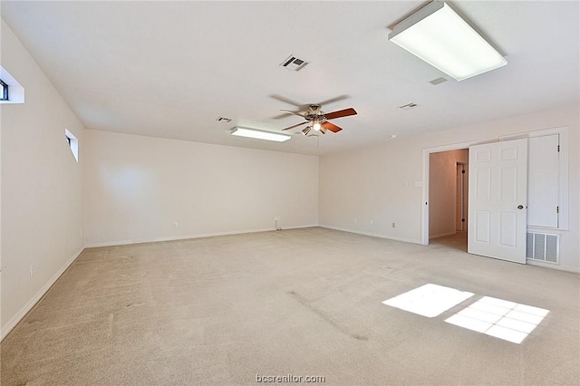 carpeted empty room with ceiling fan