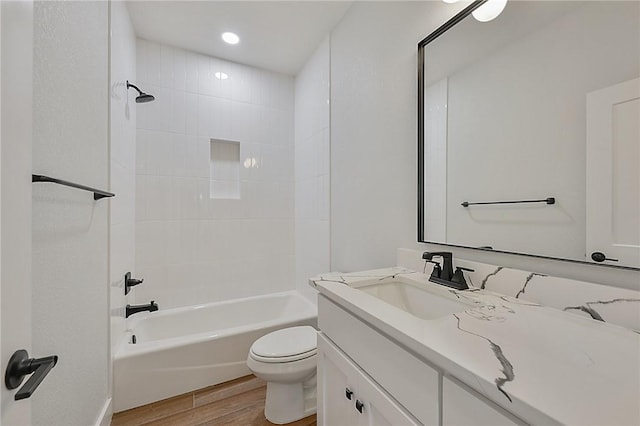 7888 Mathis Creek Dr, Bryan, TX 77808 - full bathroom with wood finished floors, vanity, toilet, and washtub / shower combination