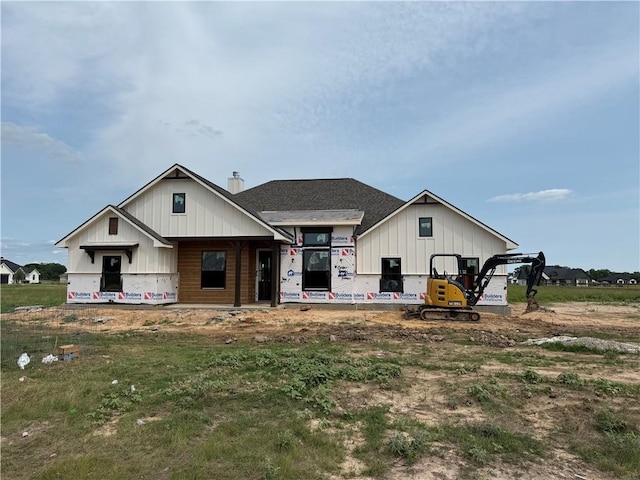 7888 Mathis Creek Dr, Bryan, TX 77808 - back of property with board and batten siding and a chimney