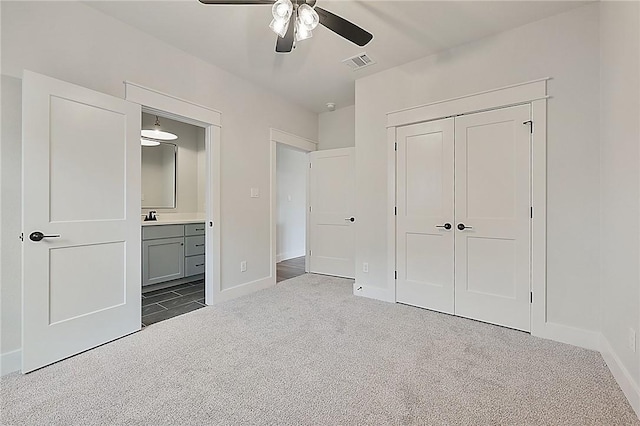 7888 Mathis Creek Dr, Bryan, TX 77808 - unfurnished bedroom featuring carpet floors, a closet, baseboards, and a sink