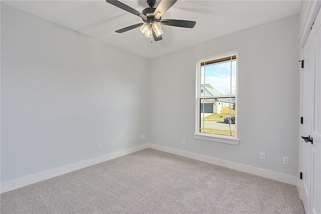 7888 Mathis Creek Dr, Bryan, TX 77808 - empty room featuring light carpet, baseboards, and a ceiling fan