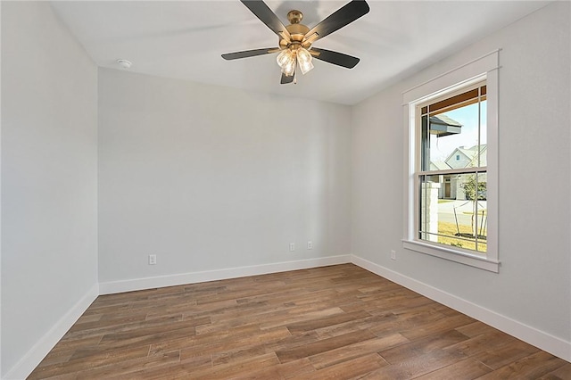 7888 Mathis Creek Dr, Bryan, TX 77808 - unfurnished room featuring healthy amount of natural light, wood finished floors, baseboards, and a ceiling fan