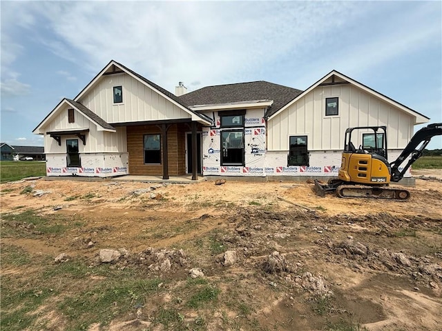 7888 Mathis Creek Dr, Bryan, TX 77808 - unfinished property featuring board and batten siding, a chimney, and a shingled roof