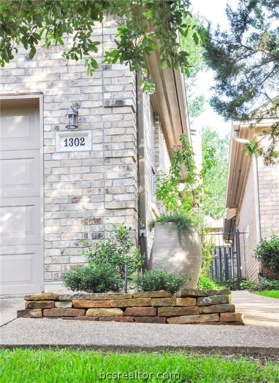 community / neighborhood sign featuring a garage