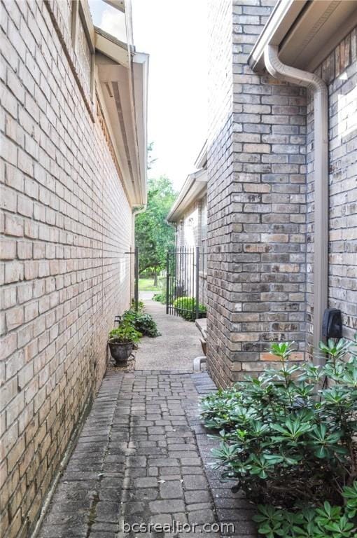 view of side of property with a patio area