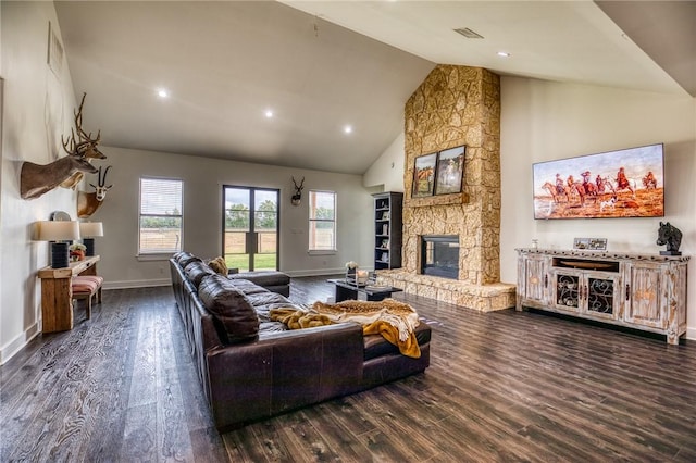 living room featuring dark wood-type flooring, a fireplace, and high vaulted ceiling