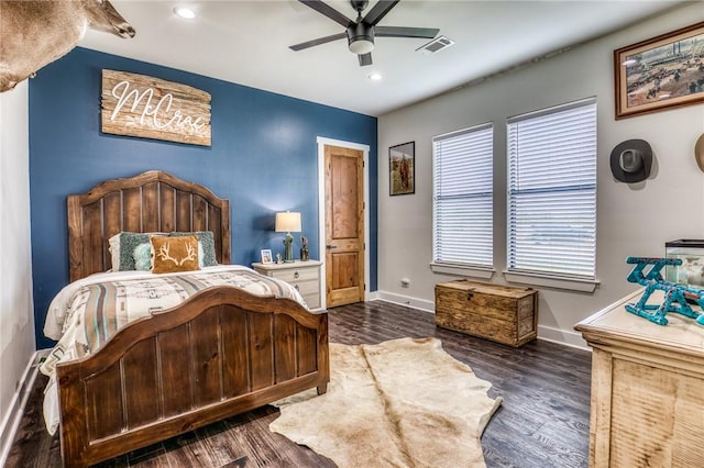 bedroom with ceiling fan and dark hardwood / wood-style flooring