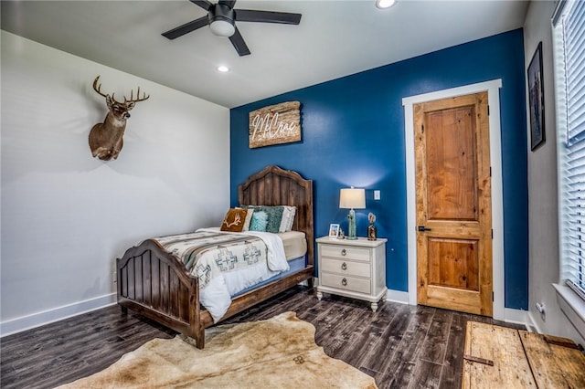 bedroom featuring ceiling fan and dark hardwood / wood-style flooring