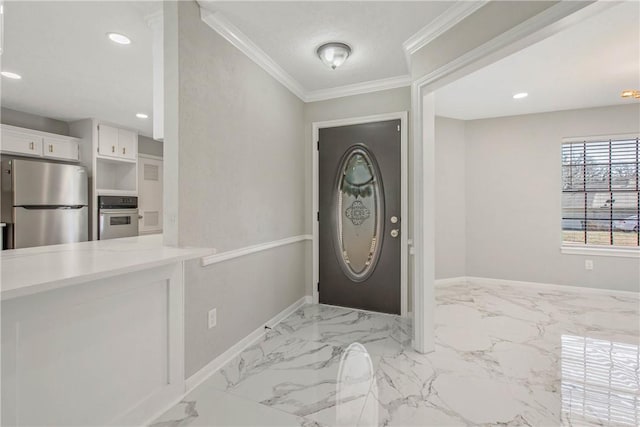 entryway with marble finish floor, baseboards, crown molding, and recessed lighting