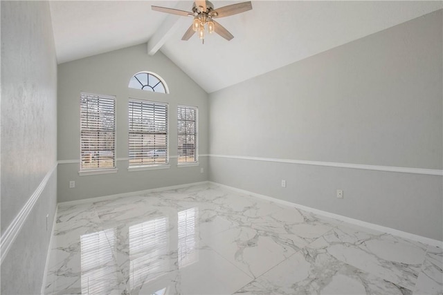 spare room featuring marble finish floor, ceiling fan, baseboards, and beam ceiling