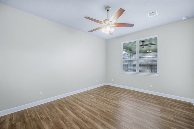 4842 Native Tree Ln, College Station, TX 77845 - unfurnished room featuring wood finished floors, baseboards, a ceiling fan, and a smoke detector