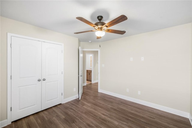 4842 Native Tree Ln, College Station, TX 77845 - unfurnished bedroom with baseboards, dark wood-style floors, a closet, and ceiling fan