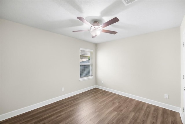 4842 Native Tree Ln, College Station, TX 77845 - empty room featuring dark wood finished floors, baseboards, and ceiling fan