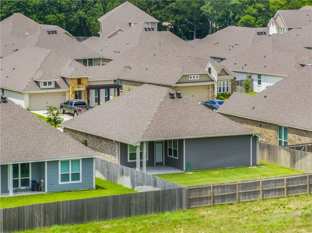 4842 Native Tree Ln, College Station, TX 77845 - back of house featuring a residential view and roof with shingles
