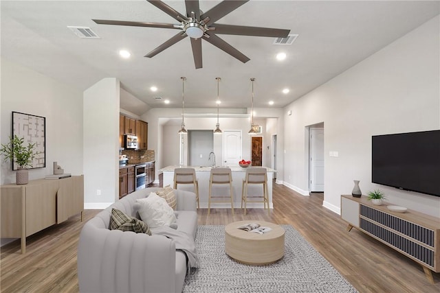 4842 Native Tree Ln, College Station, TX 77845 - living area with a ceiling fan, wood finished floors, baseboards, and recessed lighting