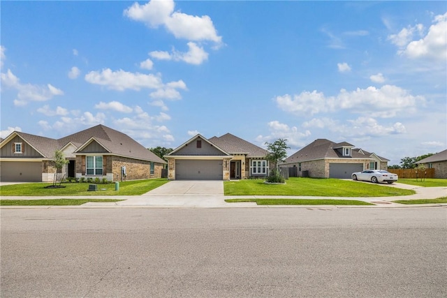 4842 Native Tree Ln, College Station, TX 77845 - view of front of house with driveway, a front yard, and an attached garage