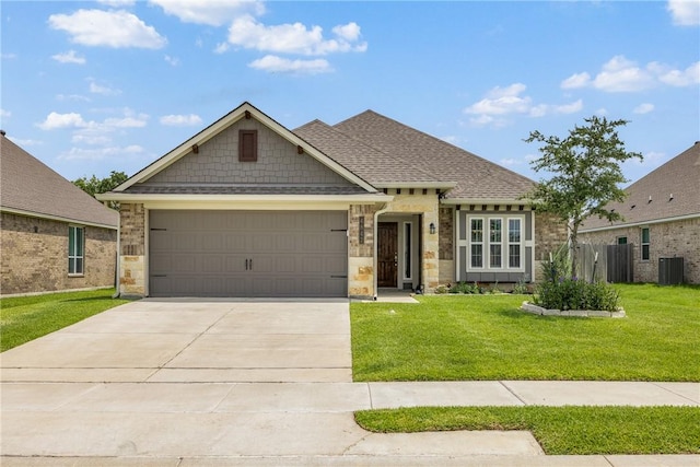 4842 Native Tree Ln, College Station, TX 77845 - view of front of property with an attached garage, central AC, a front lawn, and concrete driveway