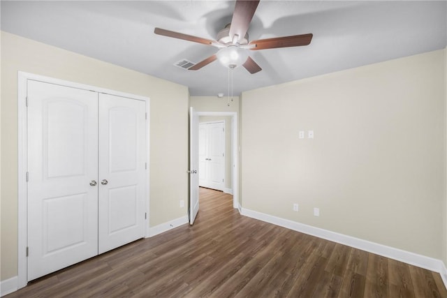 4842 Native Tree Ln, College Station, TX 77845 - unfurnished bedroom with baseboards, dark wood-type flooring, a closet, and ceiling fan