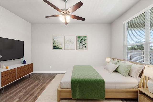 4842 Native Tree Ln, College Station, TX 77845 - bedroom with wood finished floors, ceiling fan, and baseboards