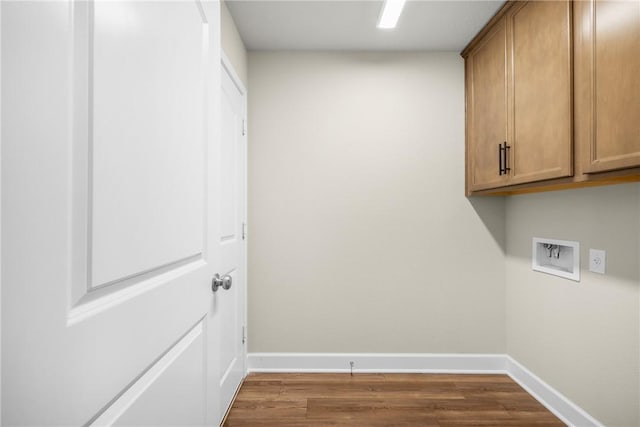 4842 Native Tree Ln, College Station, TX 77845 - laundry area featuring cabinet space, hookup for a washing machine, dark wood-style flooring, and baseboards