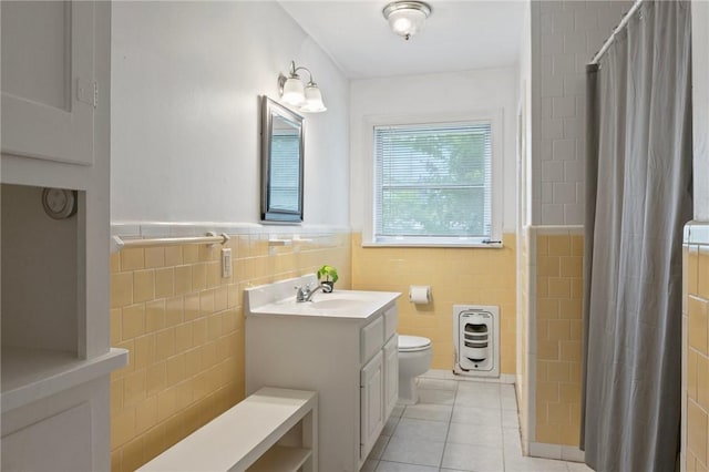 1210 Munson Ave, College Station, TX 77840 - bathroom with tile walls, tile patterned flooring, toilet, vanity, and a shower with curtain