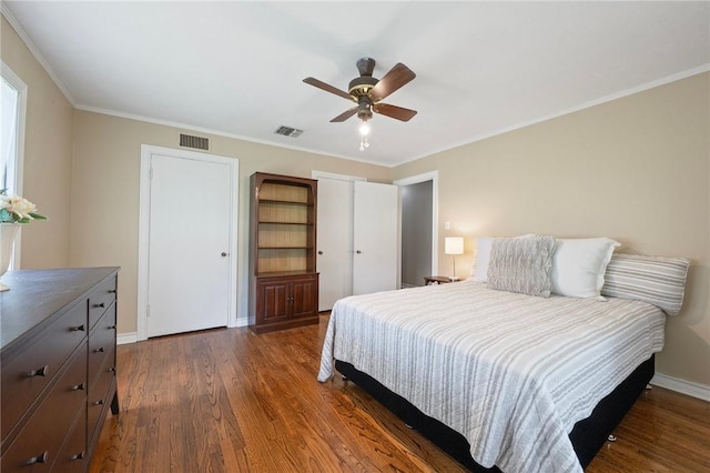 1210 Munson Ave, College Station, TX 77840 - bedroom featuring wood finished floors, baseboards, a ceiling fan, and ornamental molding