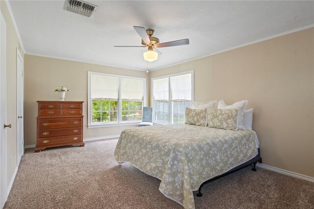 1210 Munson Ave, College Station, TX 77840 - carpeted bedroom with baseboards, ornamental molding, and a ceiling fan