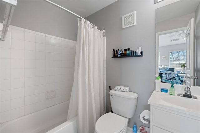 full bathroom featuring vanity, toilet, and shower / bath combo with shower curtain