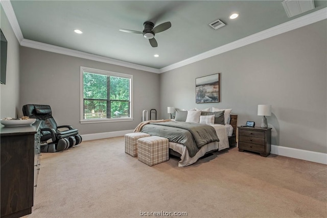 carpeted bedroom with ceiling fan and crown molding