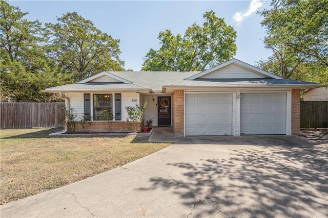 ranch-style home with driveway, brick siding, an attached garage, and fence