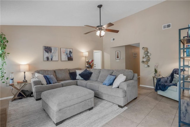 living room featuring ceiling fan, high vaulted ceiling, light tile patterned flooring, and visible vents