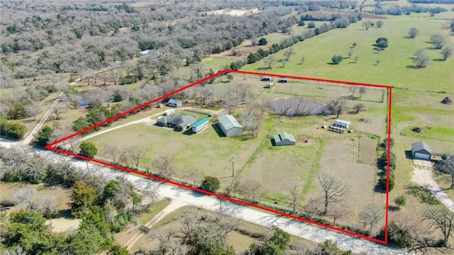 birds eye view of property with a rural view