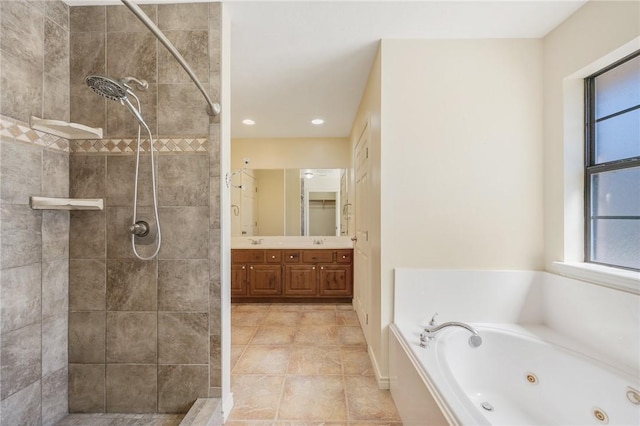 bathroom featuring a tub with jets, tile patterned flooring, a tile shower, vanity, and recessed lighting