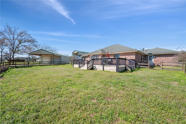 view of yard with fence and a wooden deck