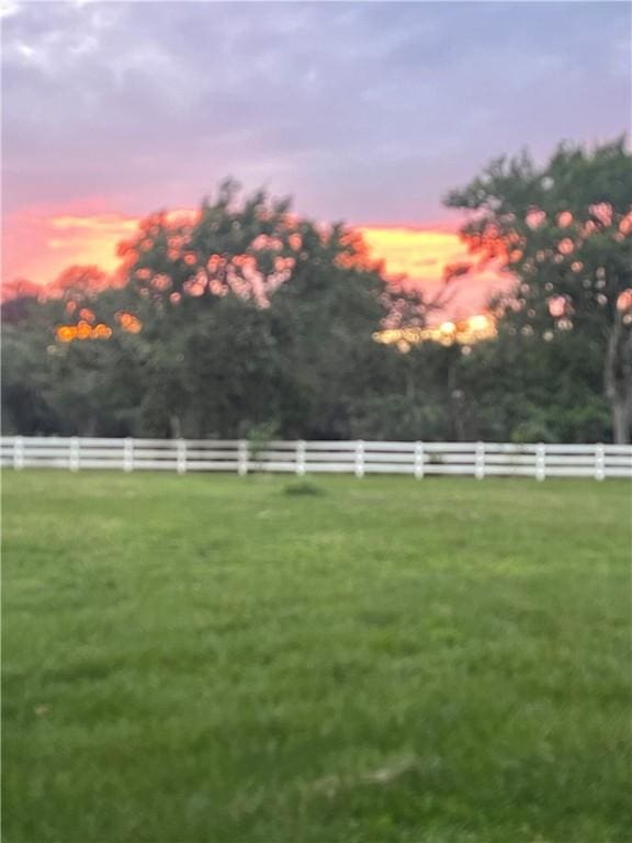 yard at dusk with fence