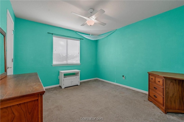 unfurnished bedroom with light colored carpet and ceiling fan