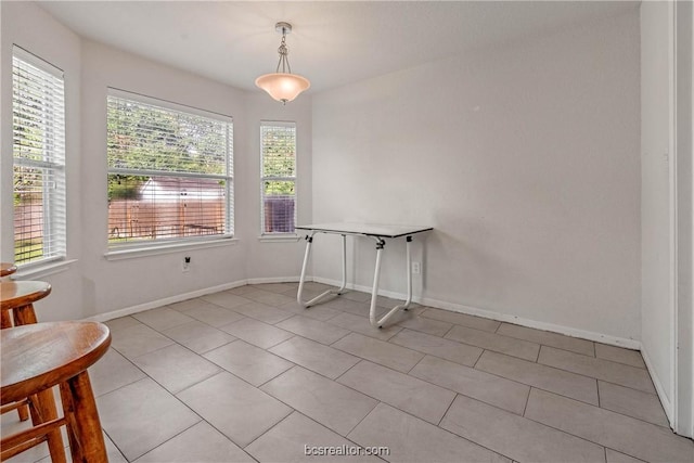 dining area with light tile patterned flooring