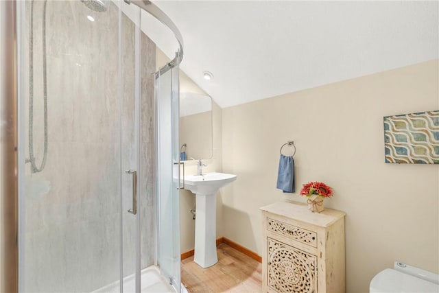 6508 Old Independence Rd, Brenham, TX 77833 - bathroom featuring a shower stall, toilet, wood finished floors, and baseboards