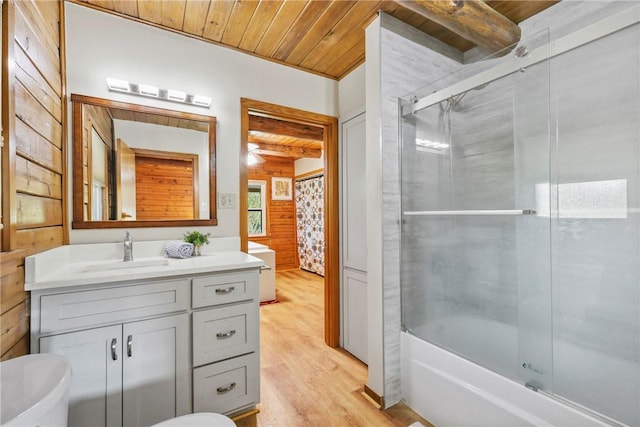 6508 Old Independence Rd, Brenham, TX 77833 - bathroom with wood ceiling, wood finished floors, vanity, beamed ceiling, and combined bath / shower with glass door