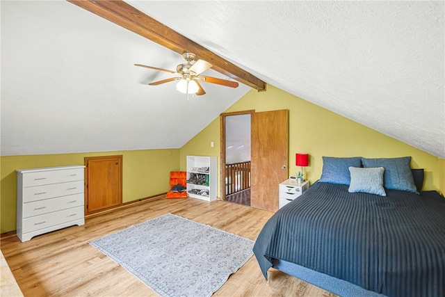 6508 Old Independence Rd, Brenham, TX 77833 - bedroom with light wood-style floors, a ceiling fan, and a textured ceiling
