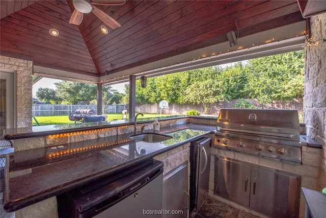 view of patio featuring an outdoor kitchen, ceiling fan, sink, and grilling area