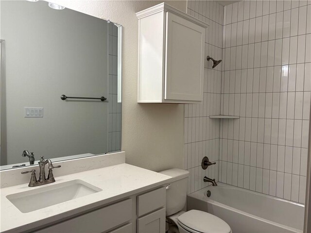 kitchen with an island with sink, hanging light fixtures, and white cabinets