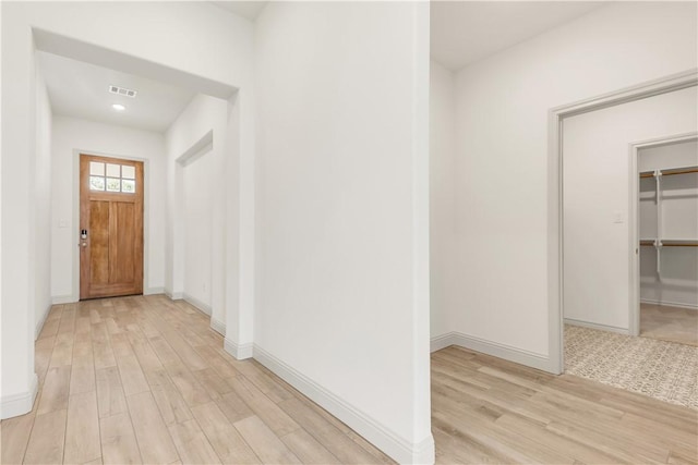 1615 Briscoe Manor Ct, College Station, TX 77845 - hallway with light wood-style flooring, baseboards, visible vents, and recessed lighting