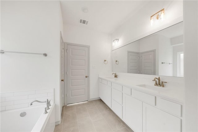 1615 Briscoe Manor Ct, College Station, TX 77845 - full bath featuring a sink, double vanity, a bath, and visible vents