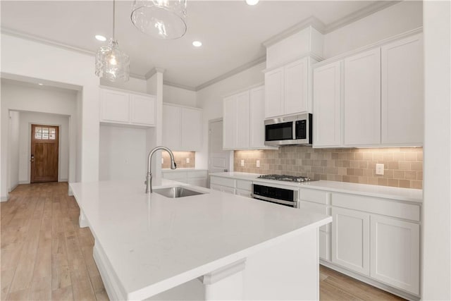 1615 Briscoe Manor Ct, College Station, TX 77845 - kitchen featuring white cabinetry, appliances with stainless steel finishes, and a sink