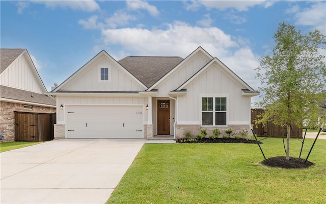 1615 Briscoe Manor Ct, College Station, TX 77845 - view of front of house featuring roof with shingles, driveway, a front lawn, and board and batten siding