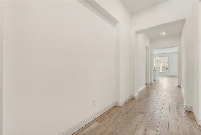 1615 Briscoe Manor Ct, College Station, TX 77845 - hallway featuring an inviting chandelier, recessed lighting, baseboards, and light wood-style floors