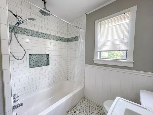 bathroom featuring tile patterned flooring, shower / tub combo, and toilet