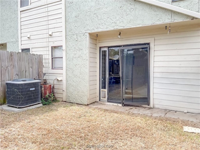 property entrance with central AC unit